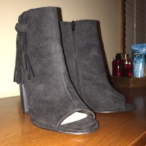 Fringe open toe booties.